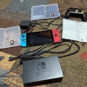 Nintendo Switch Console with Red and Blue Joy-Con and Accessories